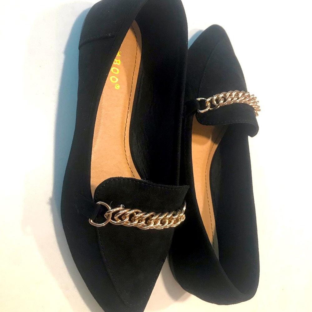 Black loafers with light gold chain